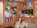 photo of Judy and her paintings